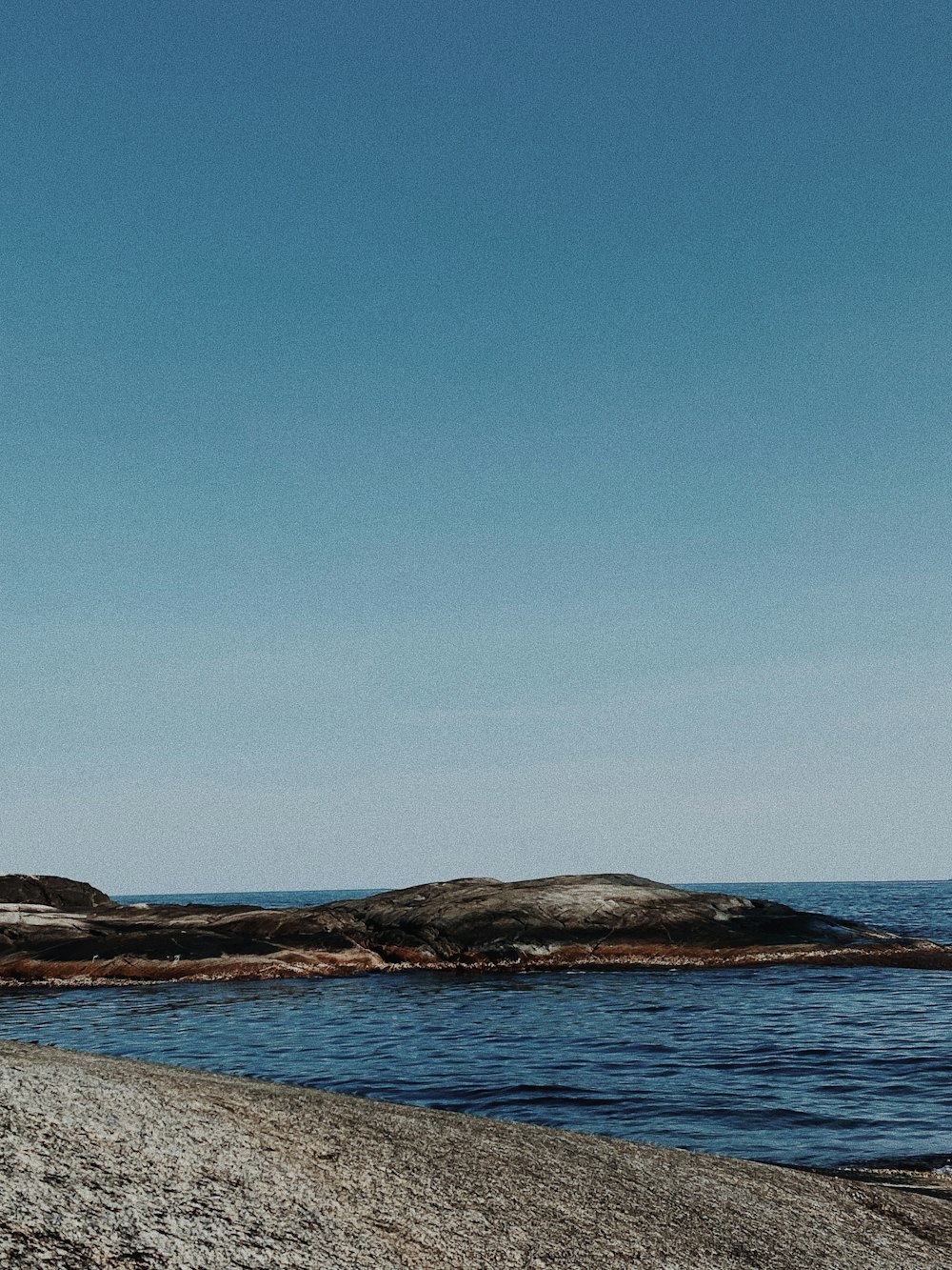 a beach with rocks and water