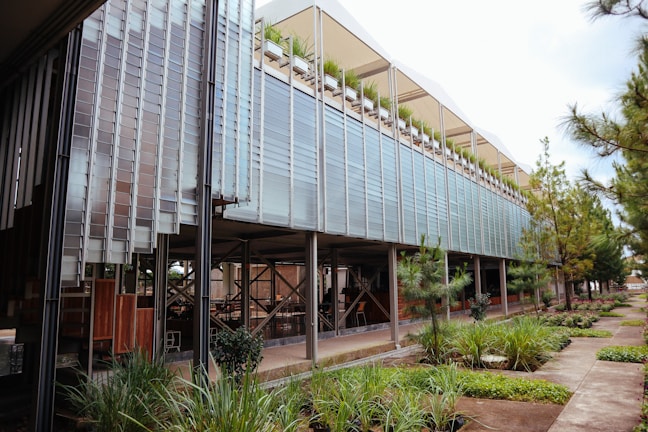 A modern building with energy-efficient features and greenery.