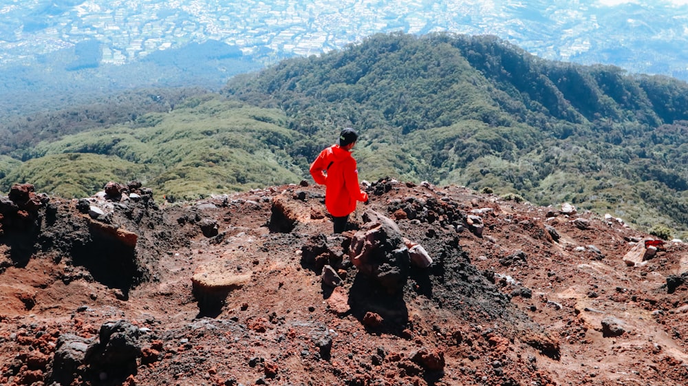 a person standing on a rocky hill