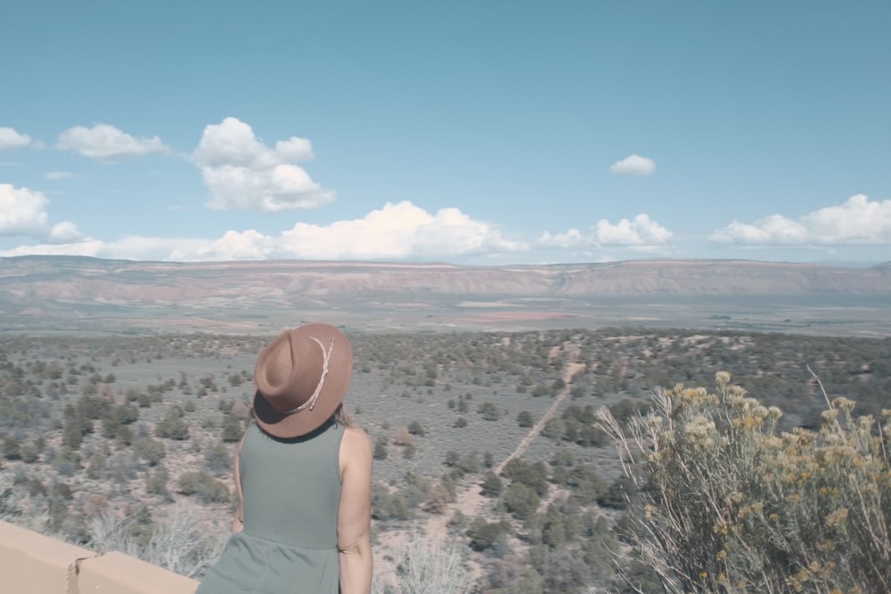 a woman looking out over a valley