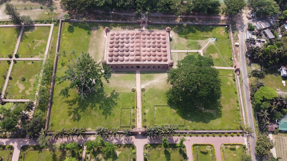 a large brick structure surrounded by trees