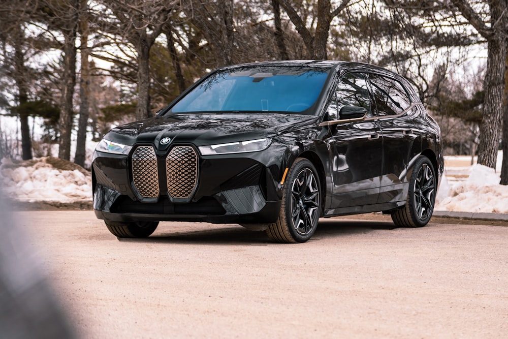 a black car parked on a road