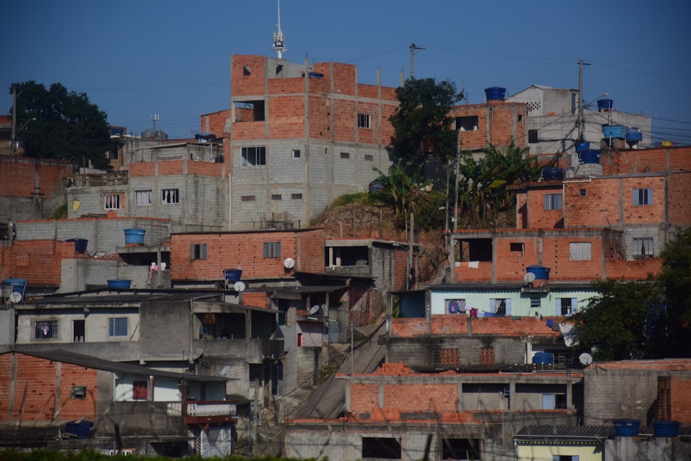 a group of buildings with trees in the front