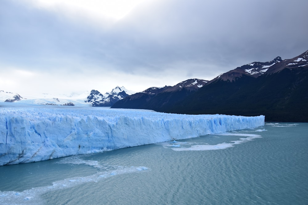 a large glacier in a snowy place