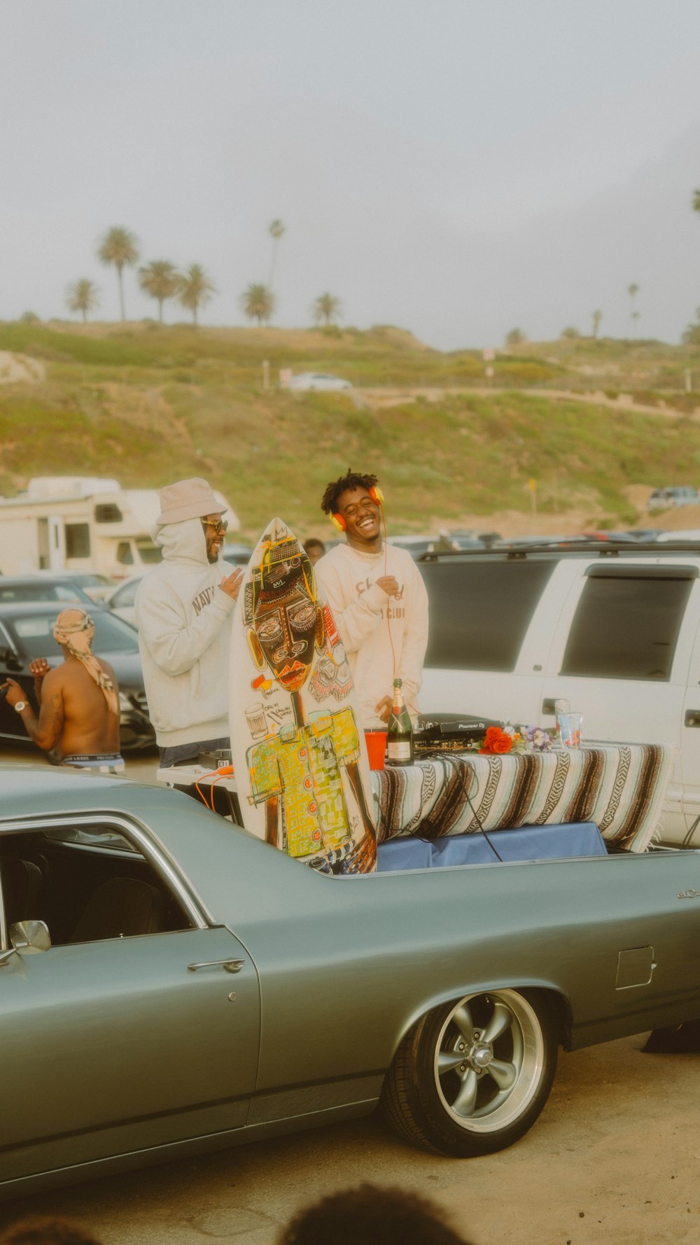 a group of people in clothing on a car