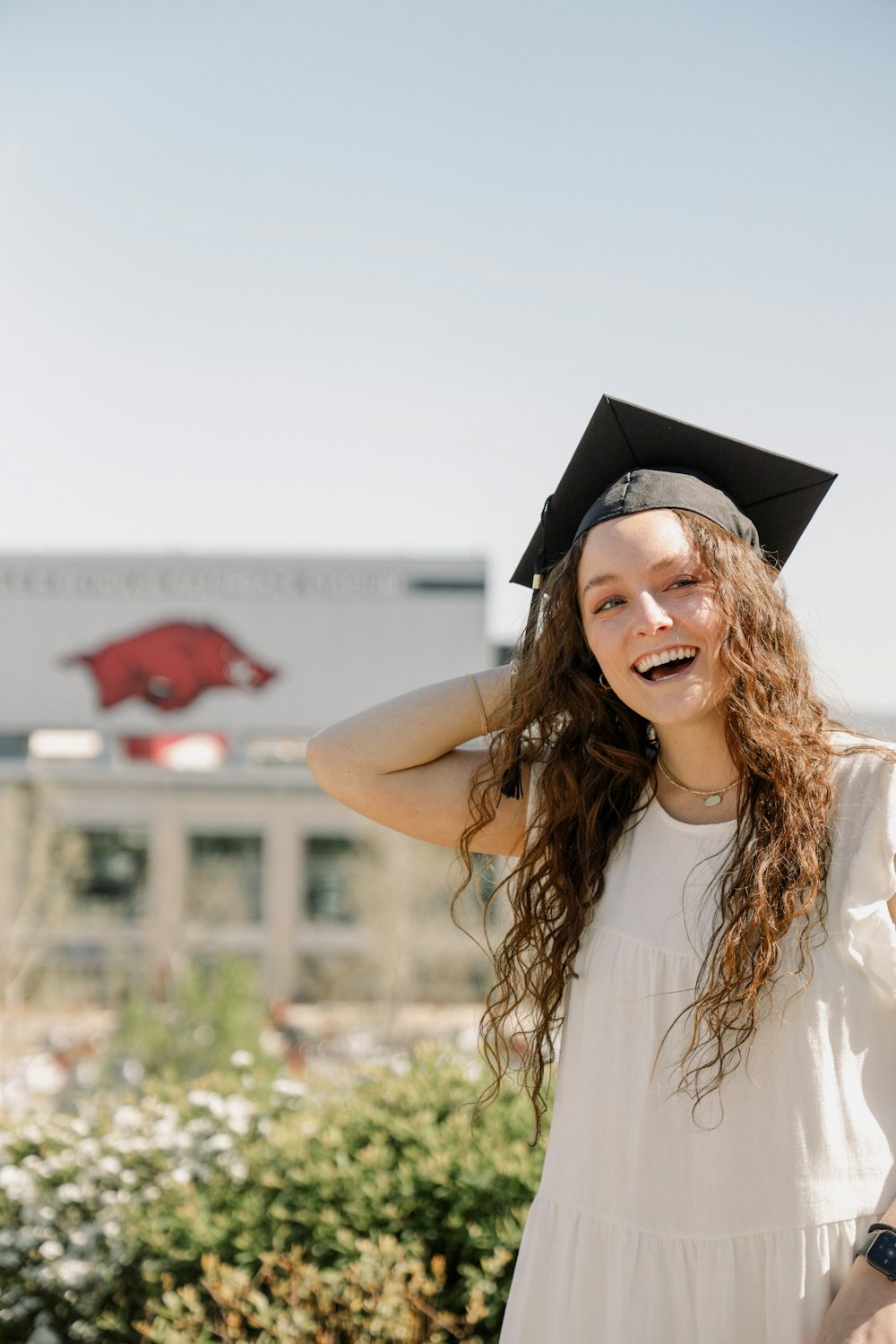 a woman wearing a graduation cap and gown