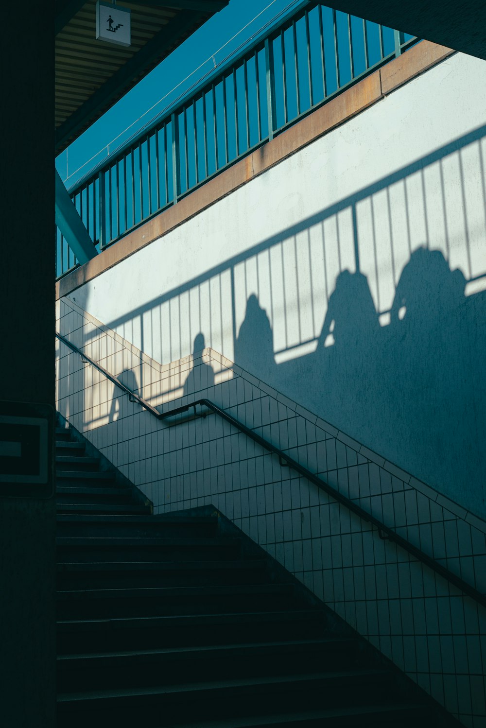 a shadow of a person on a staircase