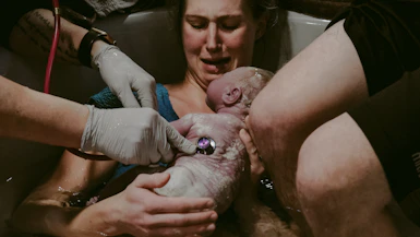 a person holding a baby