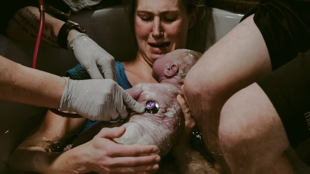 a person holding a baby