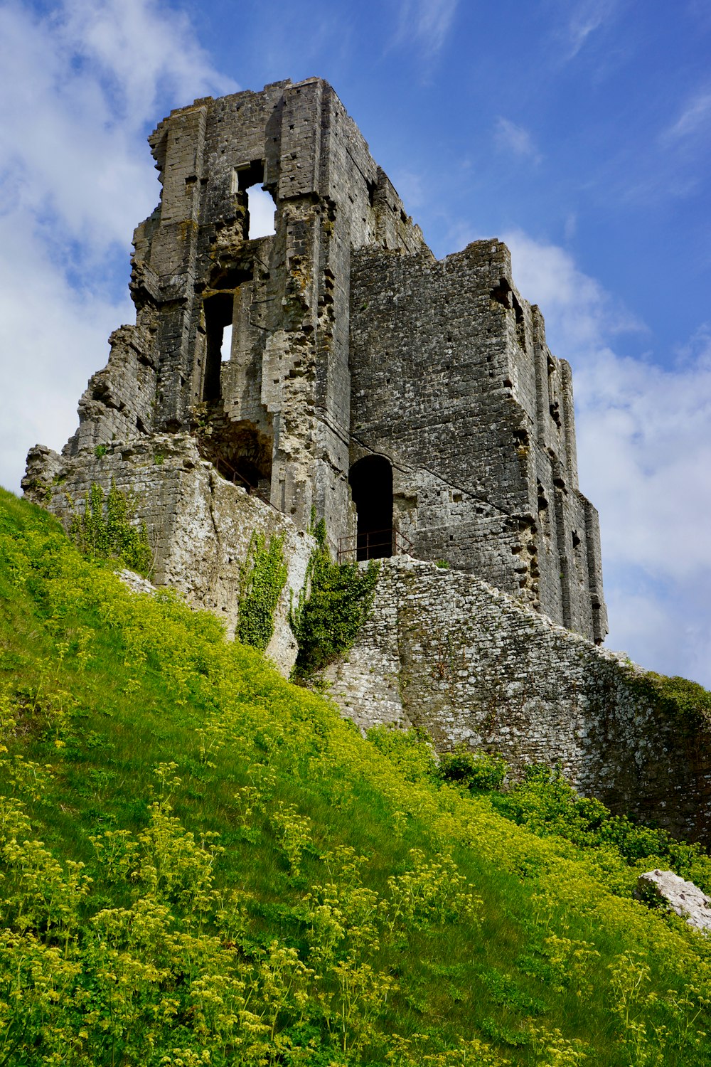 a stone castle on a hill