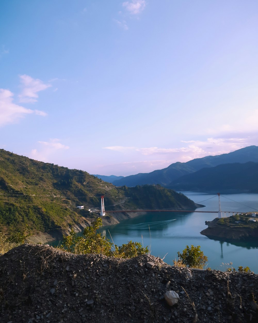 a body of water with hills around it