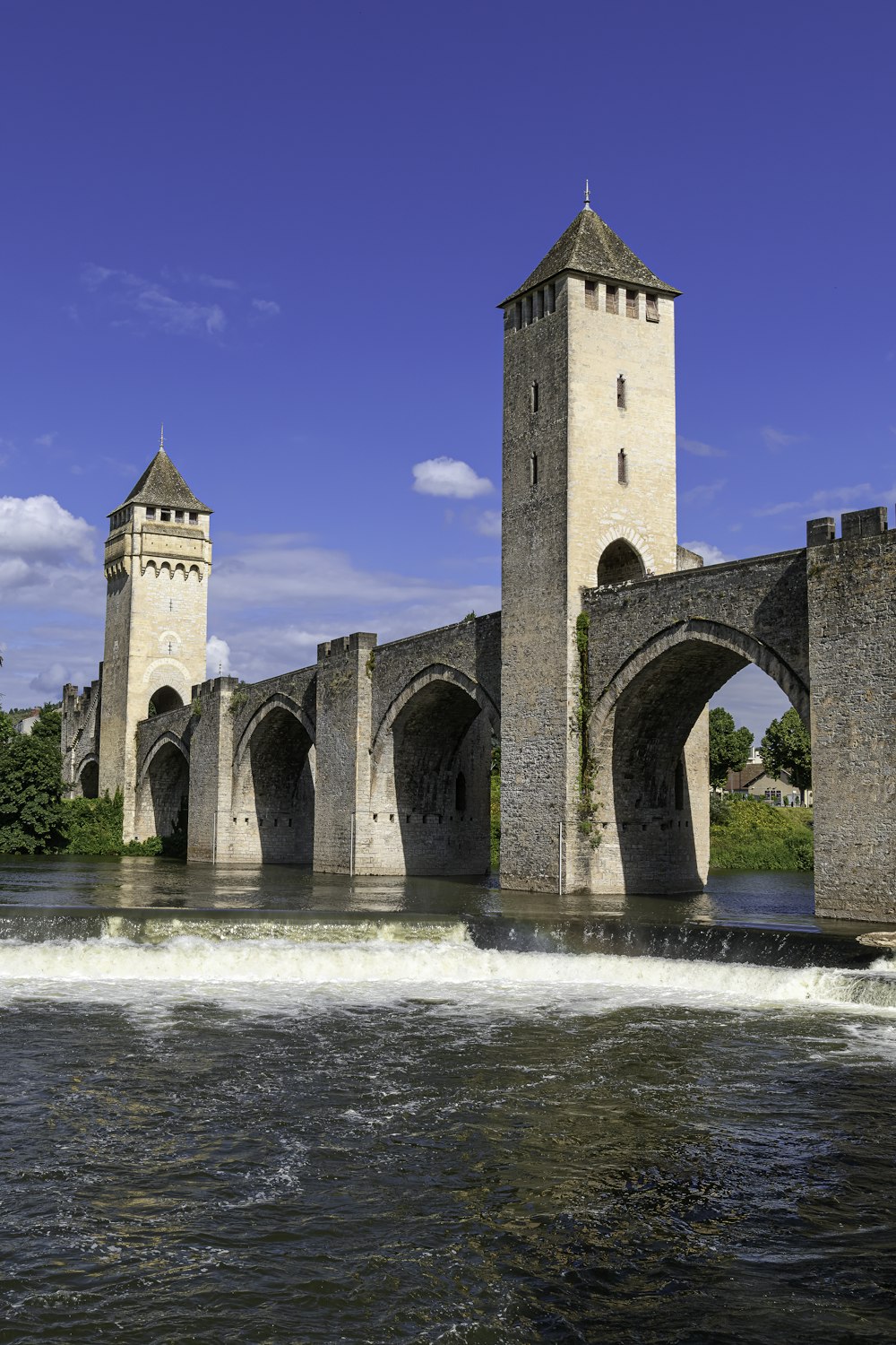 a stone bridge with towers