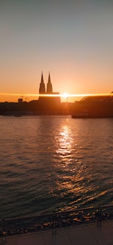 Sunset over the São Francisco River with Petrolina's cityscape in warm orange hues.