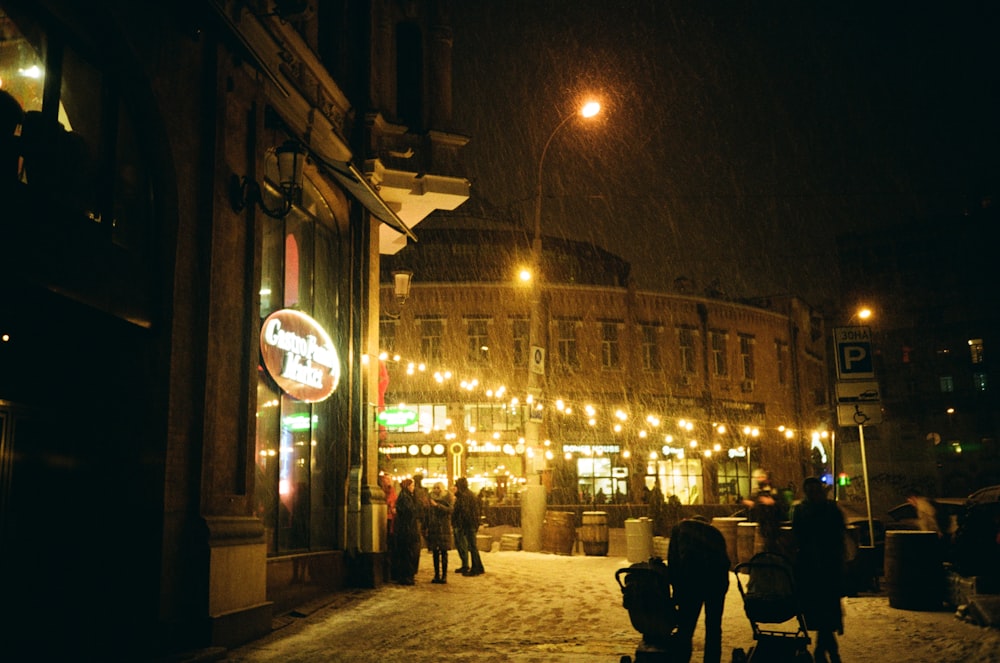 people walking on a snowy street