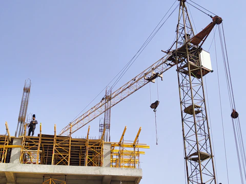 a person standing on a crane