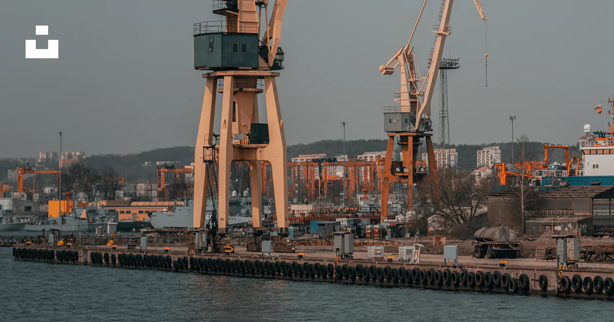 A group of cranes on a dock photo – Free Gdynia Image on Unsplash