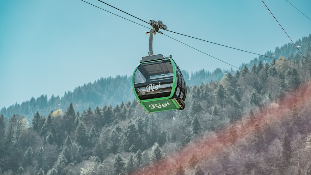 a cable car above a snowy forest