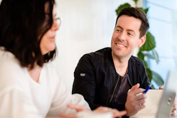 A friendly consultant explaining environmental regulations to a client.