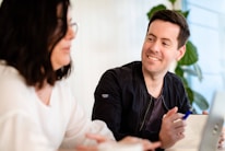 A homeowner discussing tasks with a worker in a friendly environment.