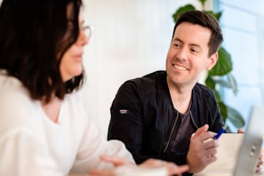 A friendly notary public discussing services with a client.