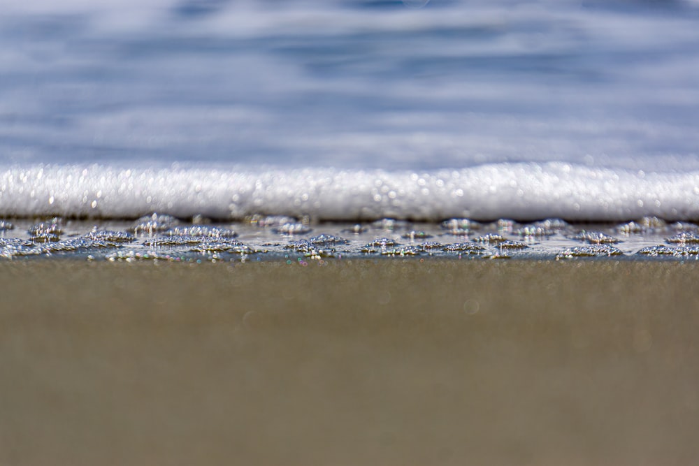 a wave crashing on a beach