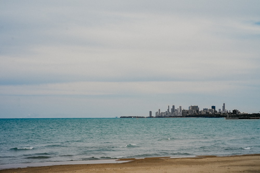 a beach with a city in the background