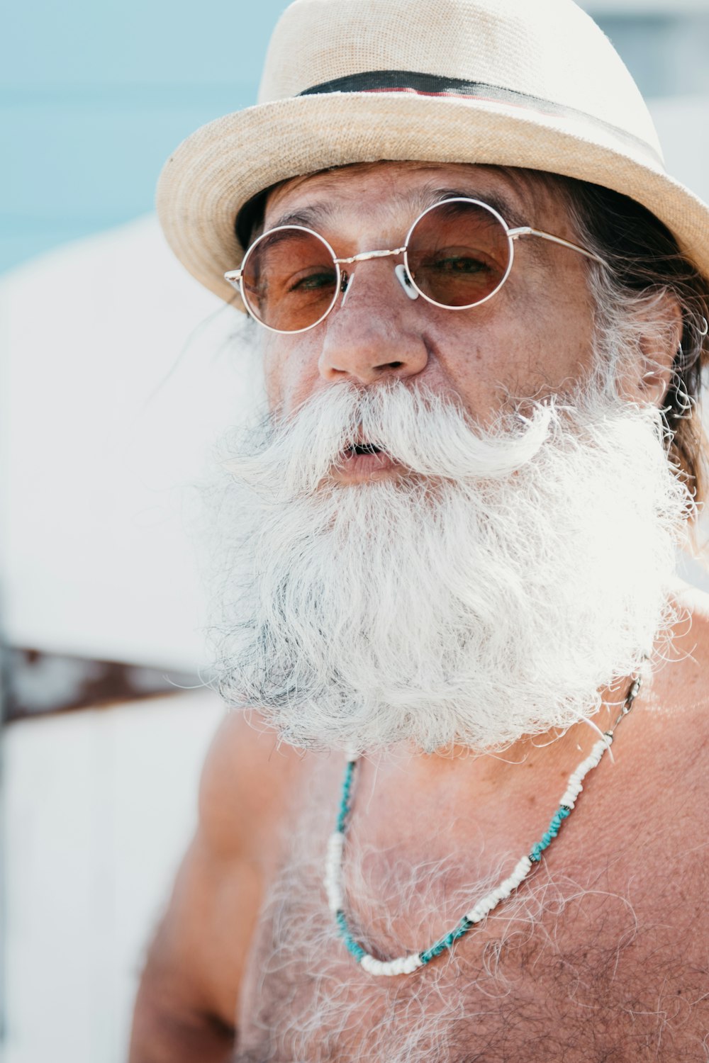 a person with a white beard and glasses