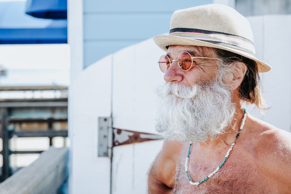 a person with a white beard and hat