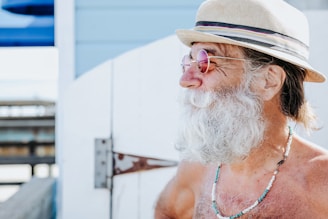 a person with a beard and hat