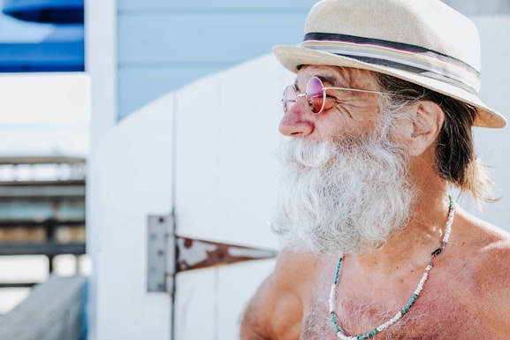 a person with a beard and hat