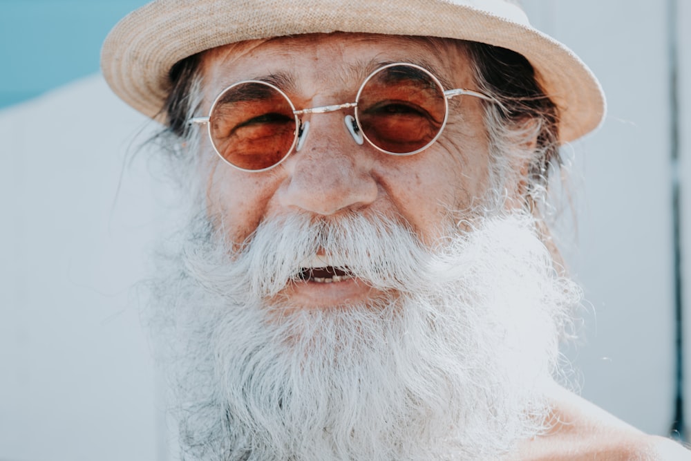a person with a white beard and glasses