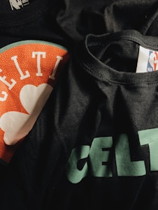 Close-up of a grndwrk™ hoodie showing distressed print of Boston skyline and logo on textured fabric.