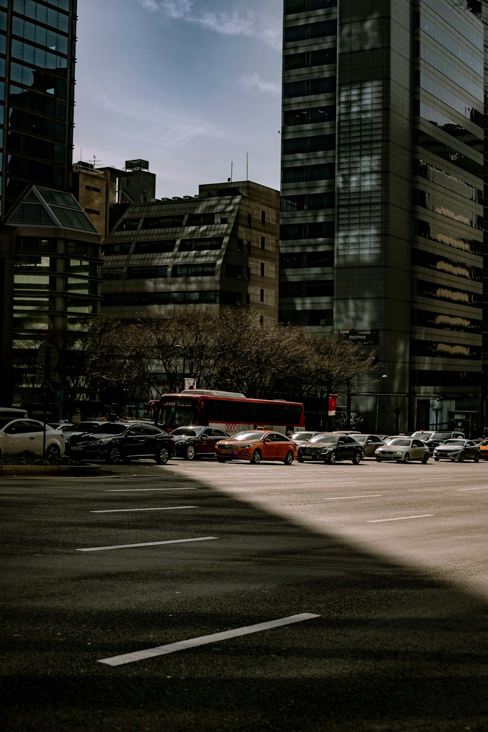 a city street with cars and buses