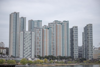 Contemporary high-rise apartment complex in Downtown Dubai with city skyline.