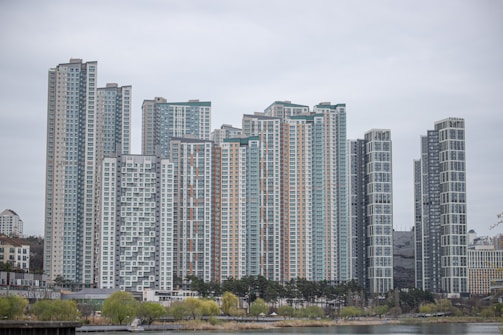 Contemporary high-rise apartment complex in Downtown Dubai with city skyline.