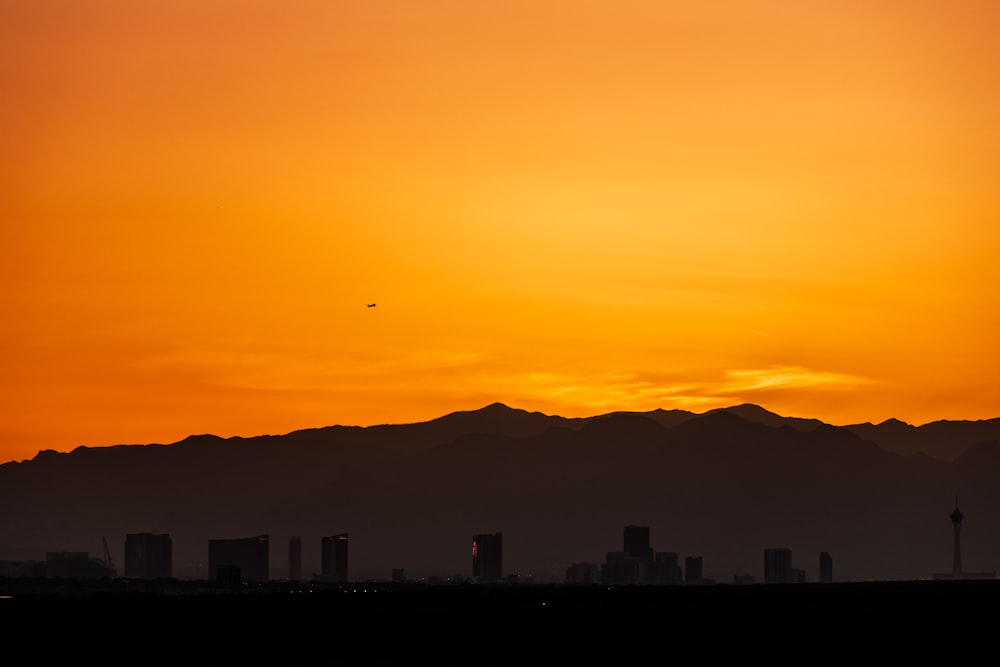 a city skyline at sunset