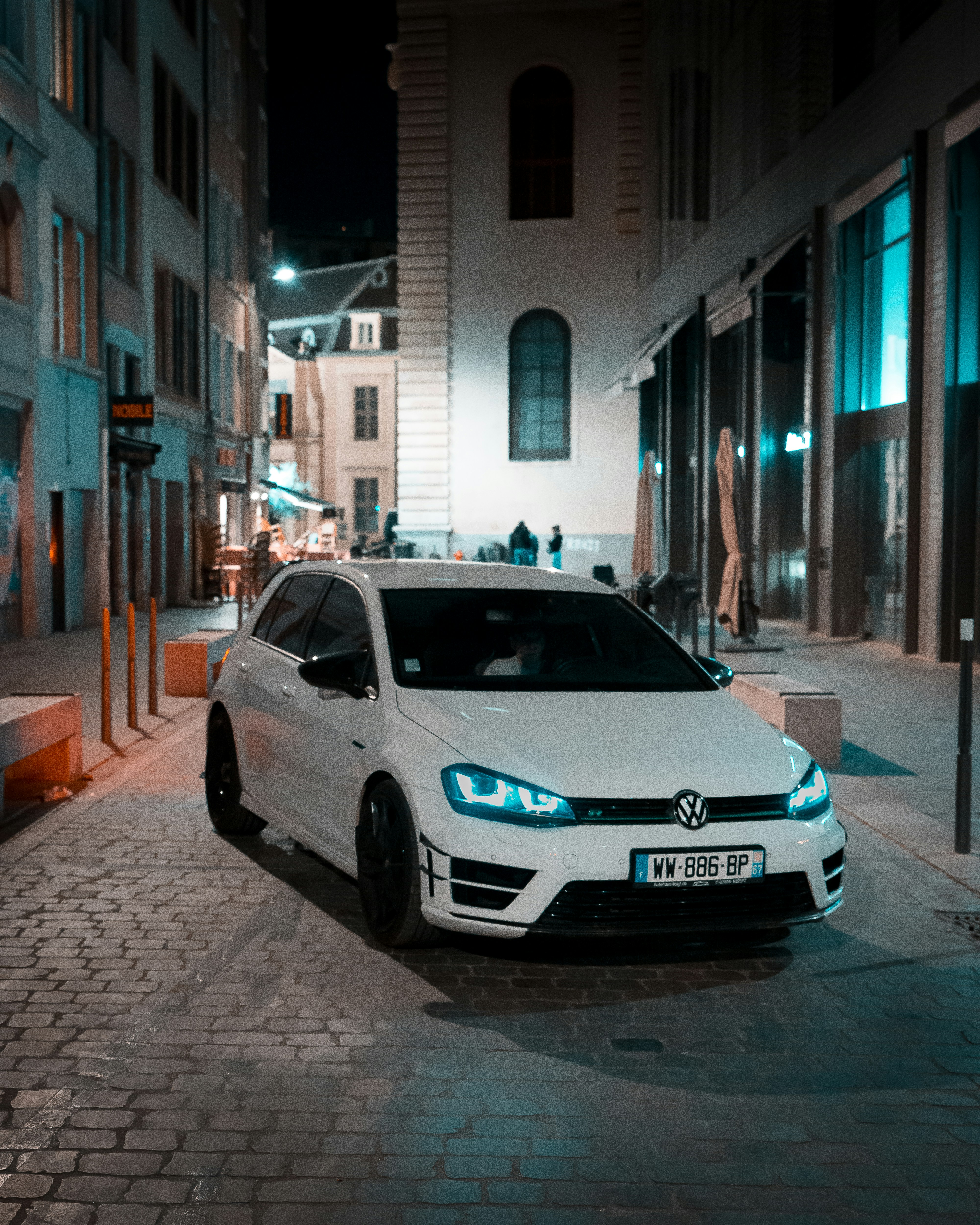a white car parked on a street