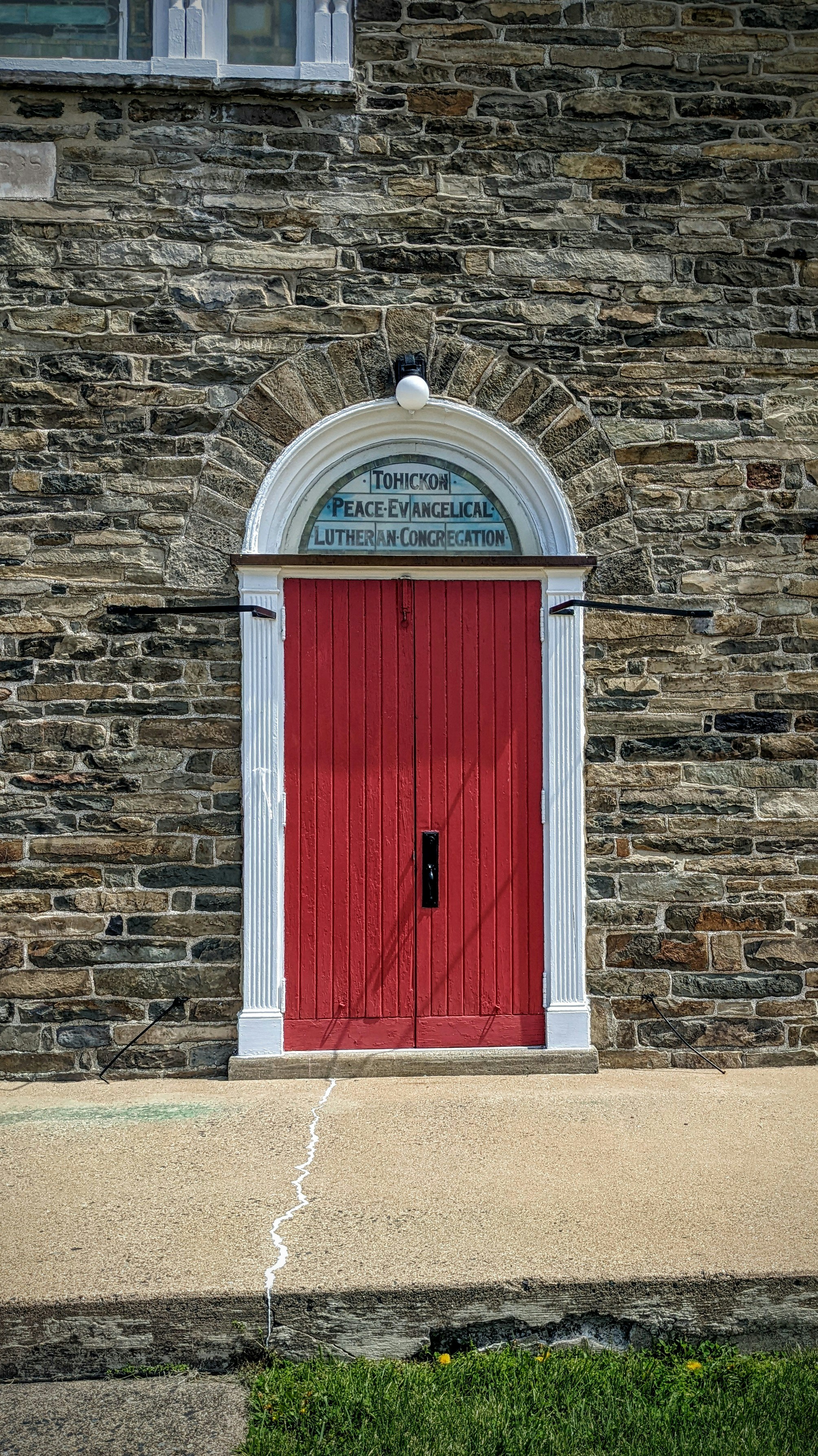 a red door on a brick building