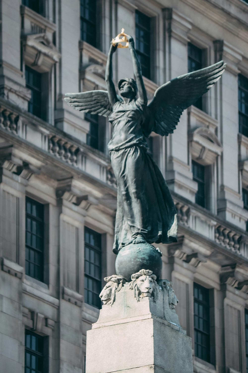 a statue of a person holding a torch