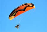 a person in a parachute