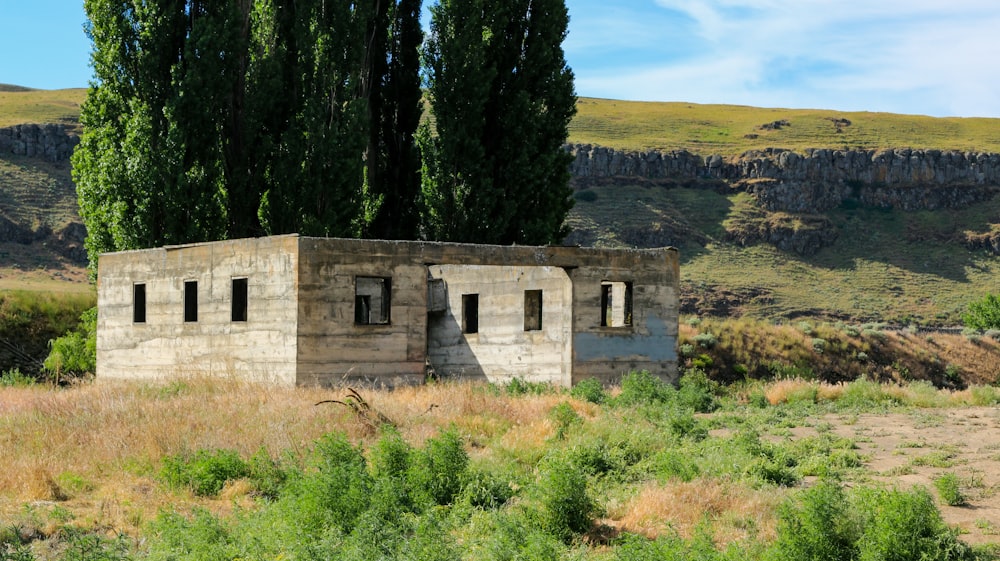 a stone building in a field