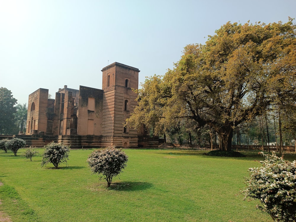 a large brick building with trees in front of it