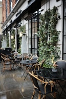a group of tables and chairs outside a building