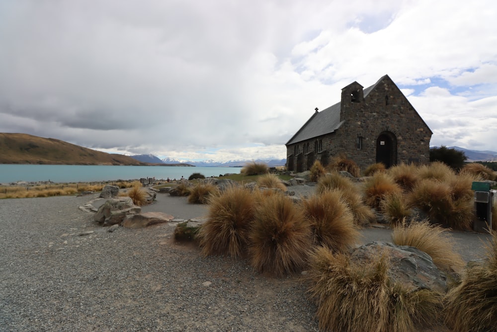 a building on a rocky beach