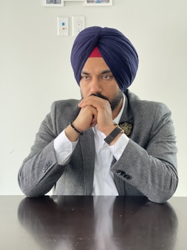 Portrait of Anoop Suri engaged in a thoughtful discussion.