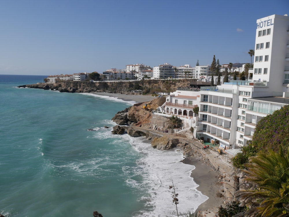 a beach with buildings along it