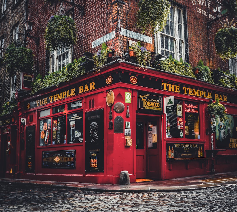 a red building with windows with Temple Bar, Dublin in the background