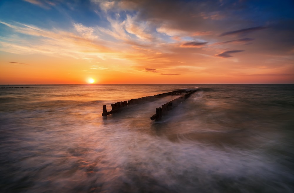 a sunset over a body of water