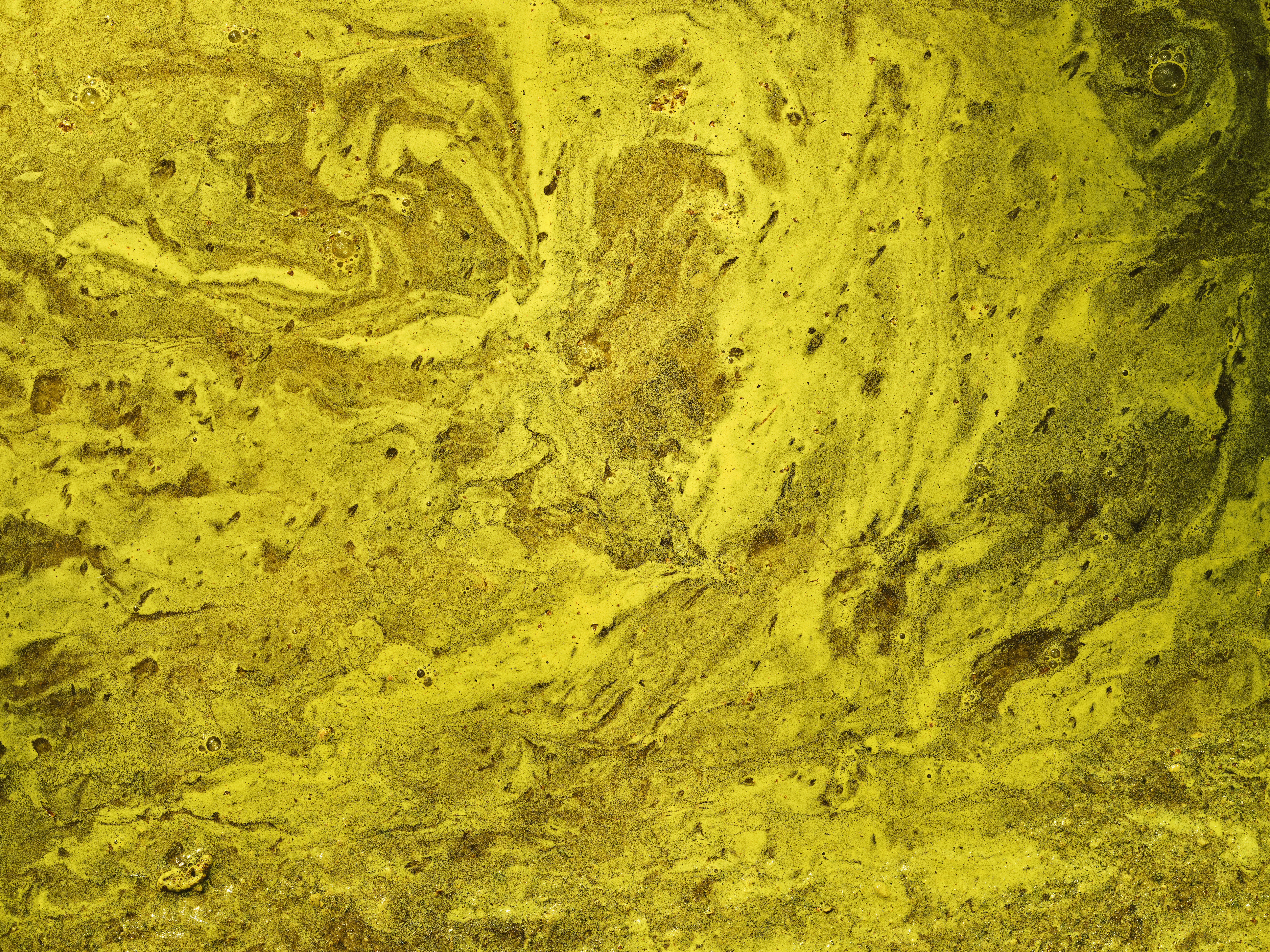 yellow abstract color paints on water surface