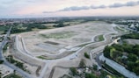 Timelapse-style photo showing progression of a land parcel from raw plot to initial development.